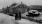 Fotografie - Ein zerstörter deutscher Panzer wird auf Grundstück mit zerstörten Häusern abgestellt 1945.